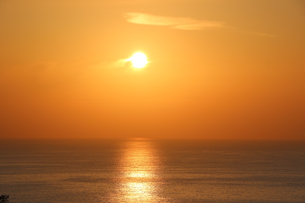 body of water during sunset