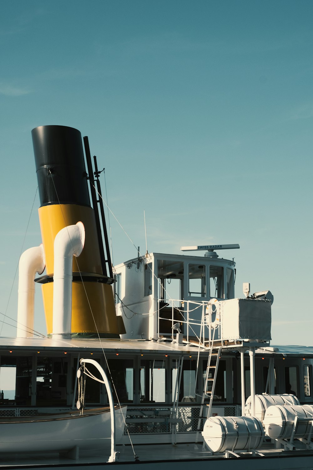 white and black ship on sea during daytime