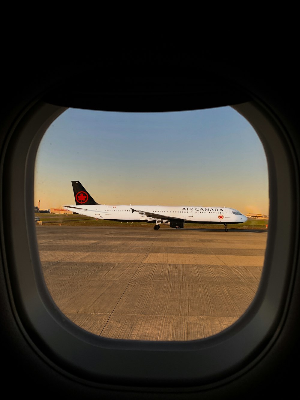 white passenger plane on airport during daytime