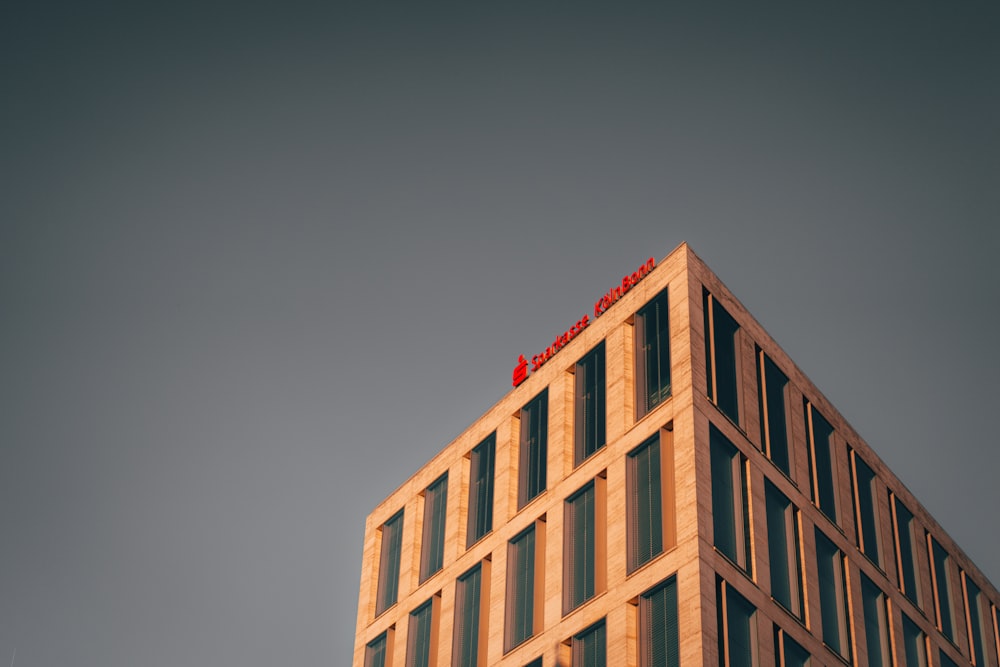 brown concrete building under gray sky