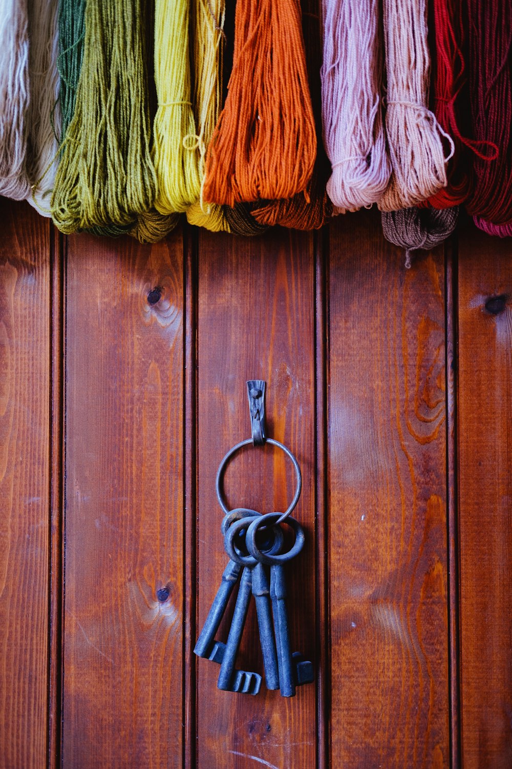 black and yellow key on brown wooden door