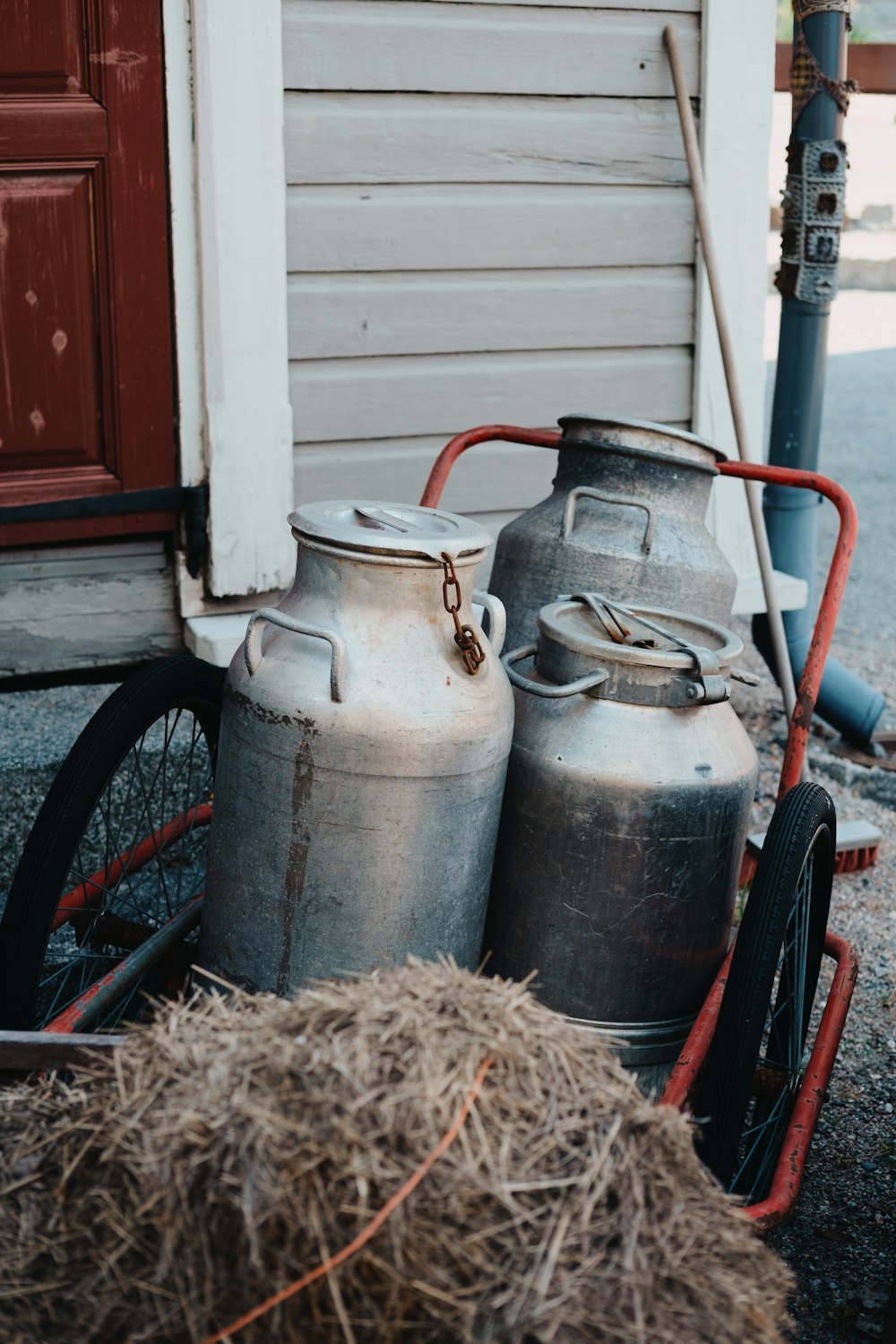 red and black bicycle with gray concrete wall