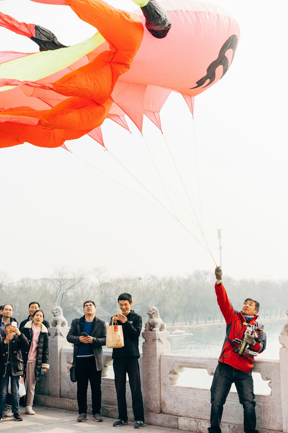 people in red and white clothes with red and white parachute