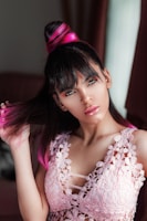 A stylish woman showing off a sleek new haircut with natural highlights.