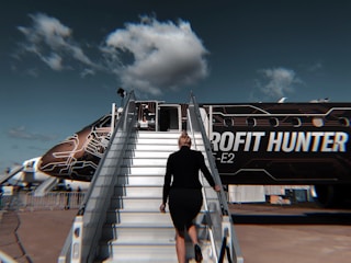 man in black t-shirt and black pants walking on stairs