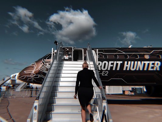 man in black t-shirt and black pants walking on stairs