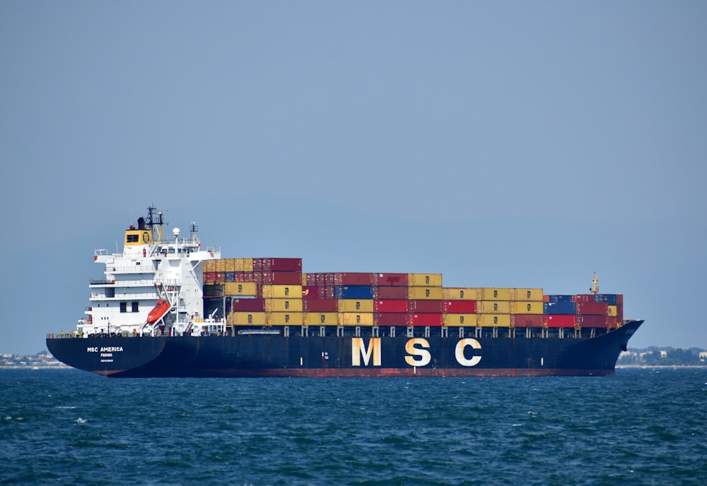 black and white ship on sea during daytime