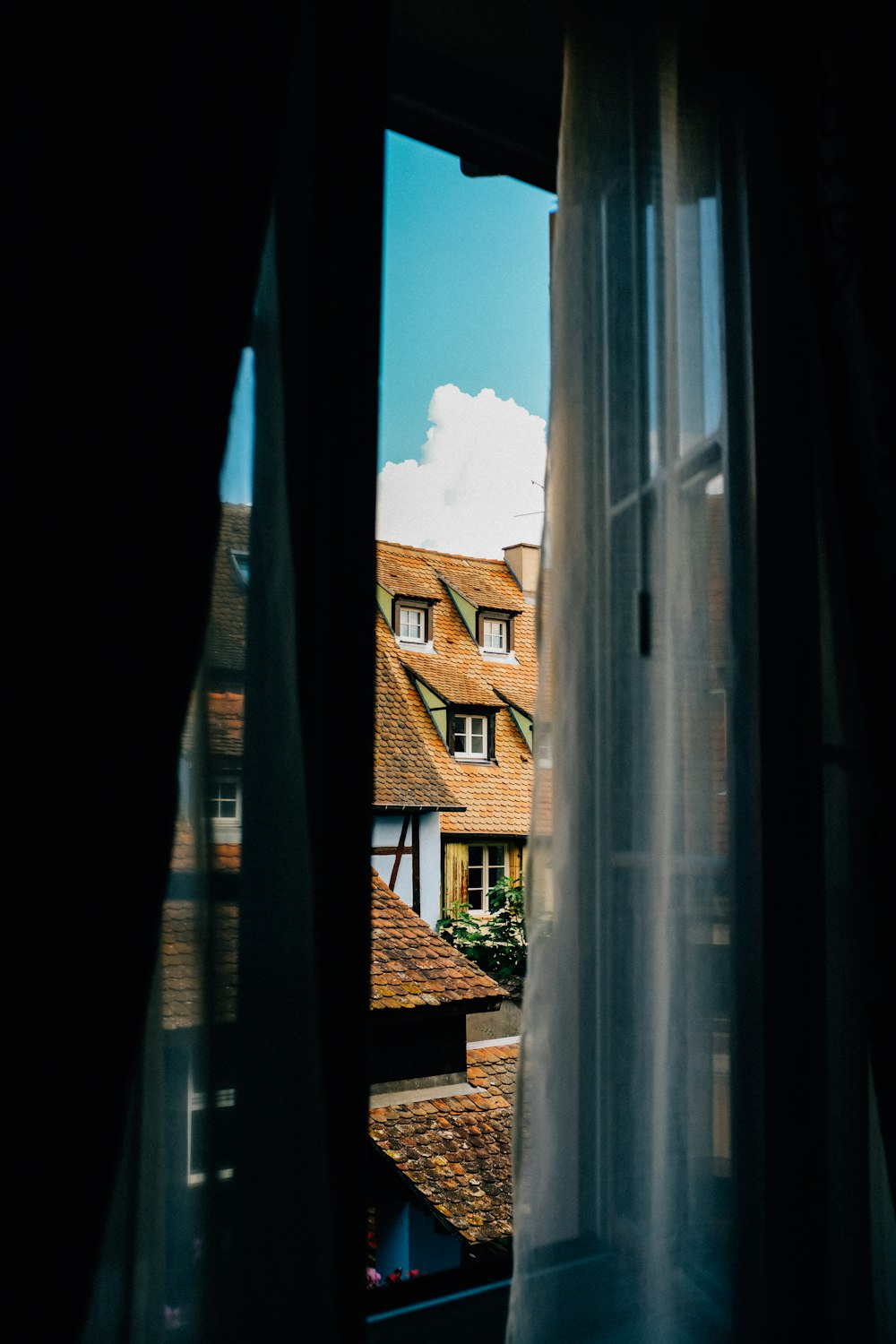 brown brick house under blue sky during daytime