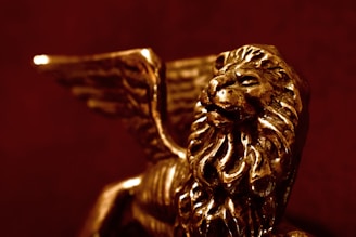 Close-up of a delicate bronze sculpture showing fine details achieved through lost-wax casting.