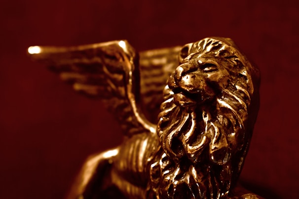 Close-up of a delicate bronze sculpture showing fine details achieved through lost-wax casting.