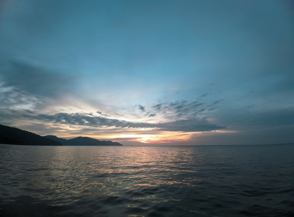 body of water under blue sky during daytime