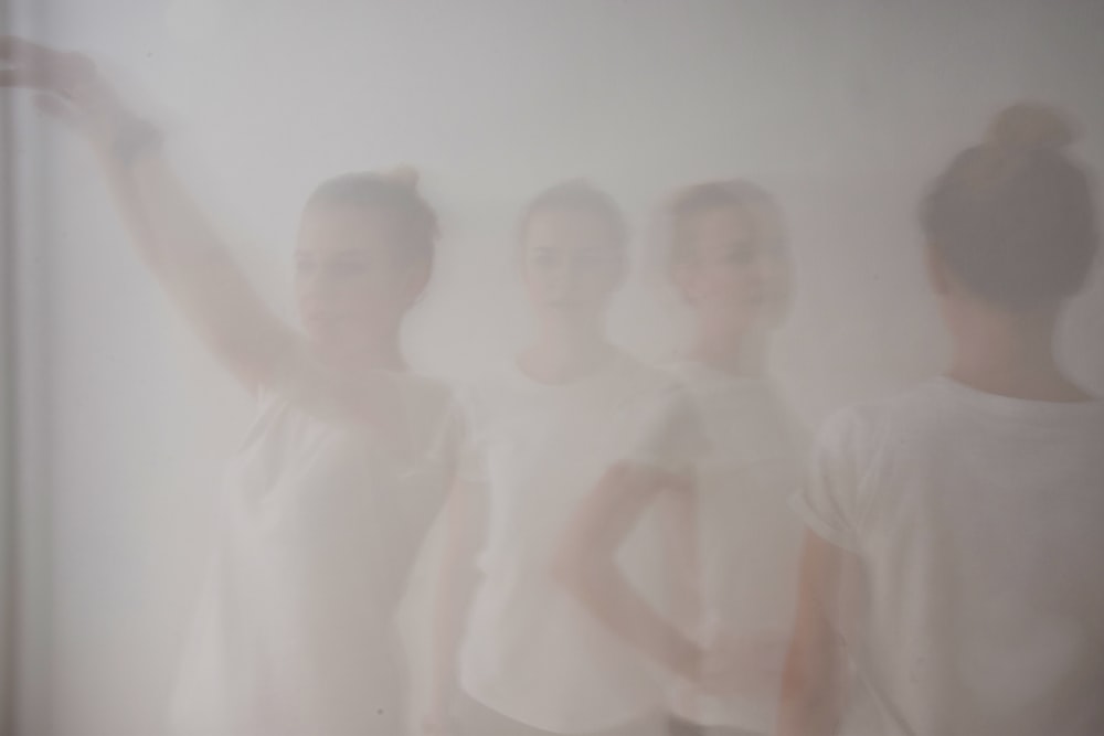 3 boys in white shirts