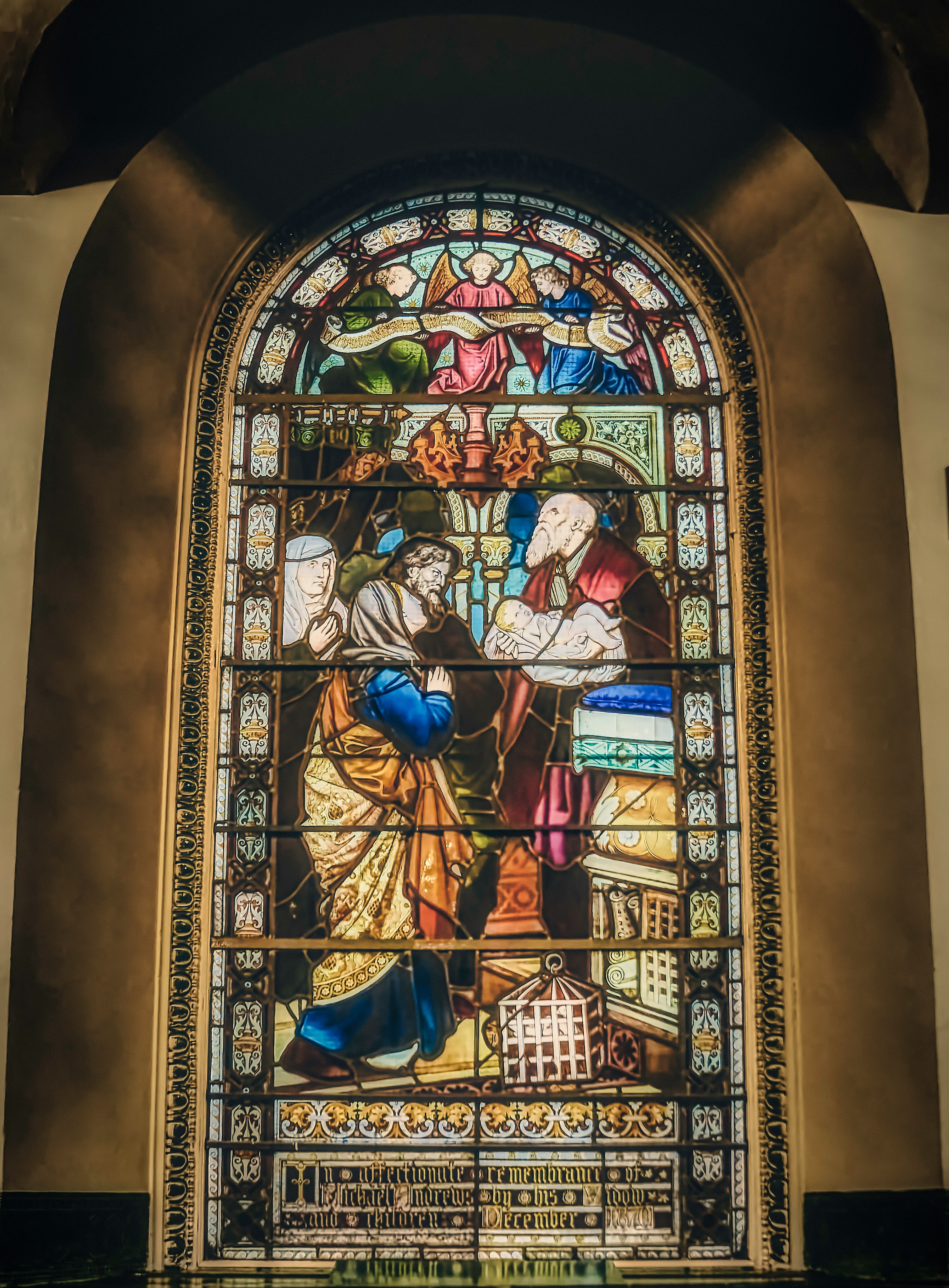 Stained-glass window in the First Presbyterian Church in Belfast's City Centre, which is Belfast's oldest surviving church building (built 1781-83). The scene depicts the story from Luke 2: 22-39 where the baby Jesus is taken to the temple in Jerusalem where Mary and Joseph encounter Simeon and the prophetess Anna (Jan., 2020).