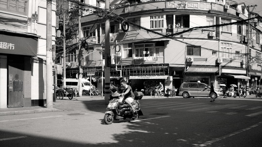 people riding motorcycle on road during daytime