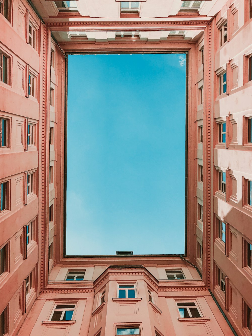 brown concrete building under blue sky during daytime