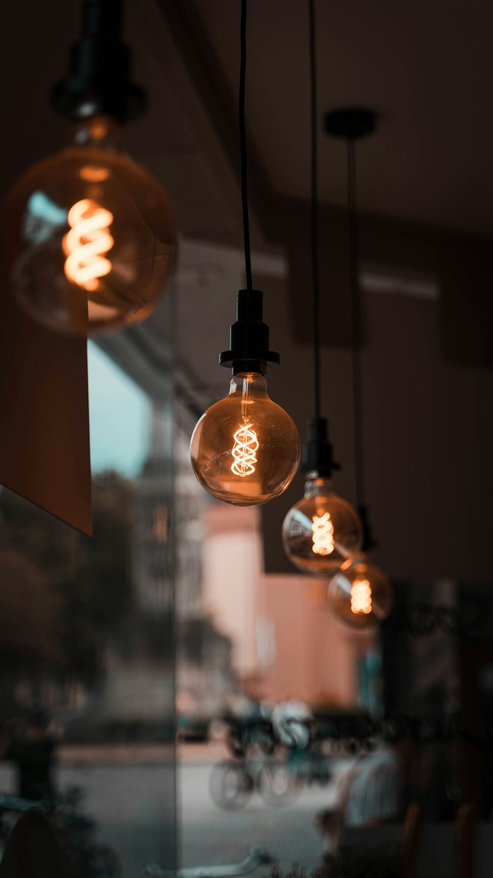 selective focus photography of pendant lamps