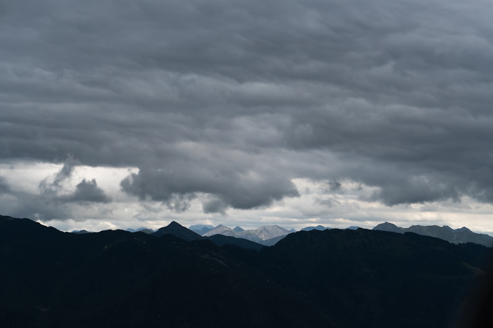 black mountains under gray clouds