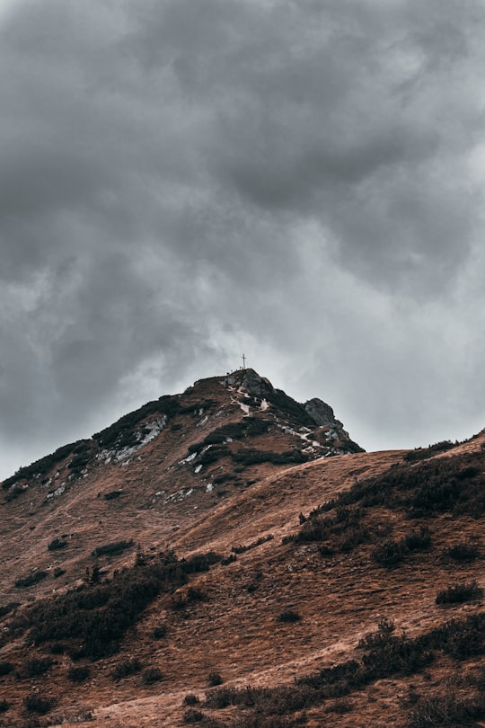 brown and green mountain under white clouds in Flachau Austria