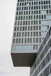 a very tall building with a clock on it's side