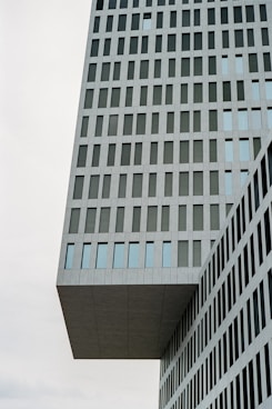 a very tall building with a clock on it's side