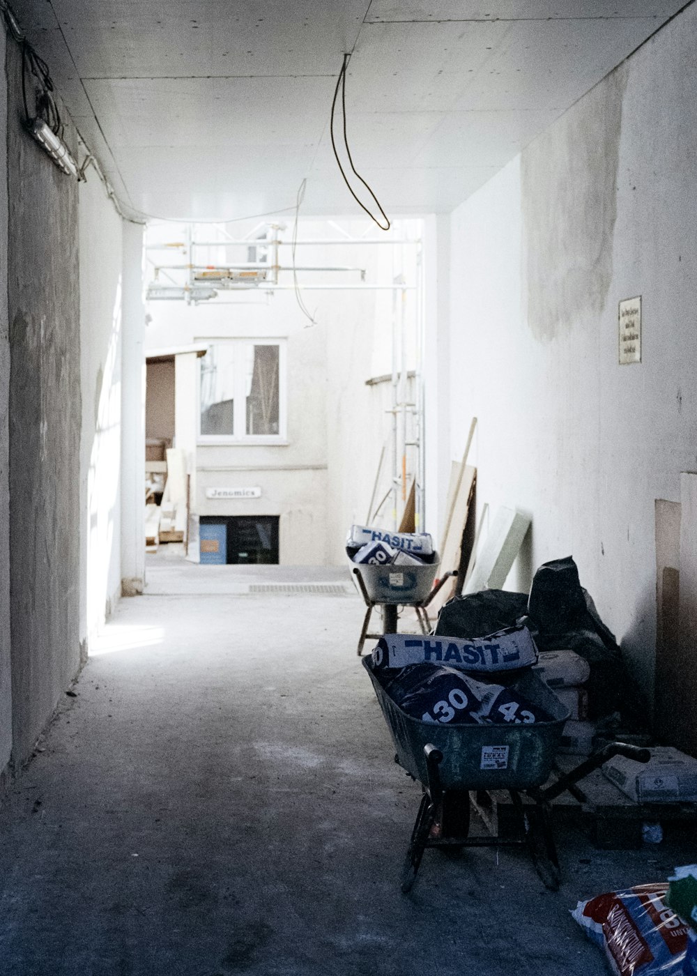 black and white metal armchair near white wall