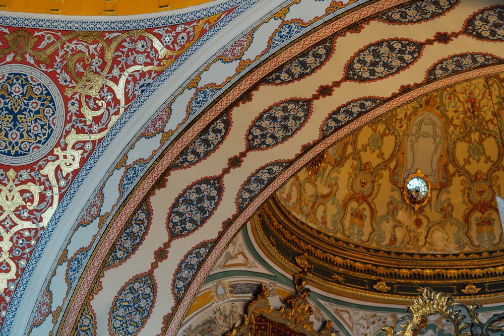 the ceiling of a building with a clock on it