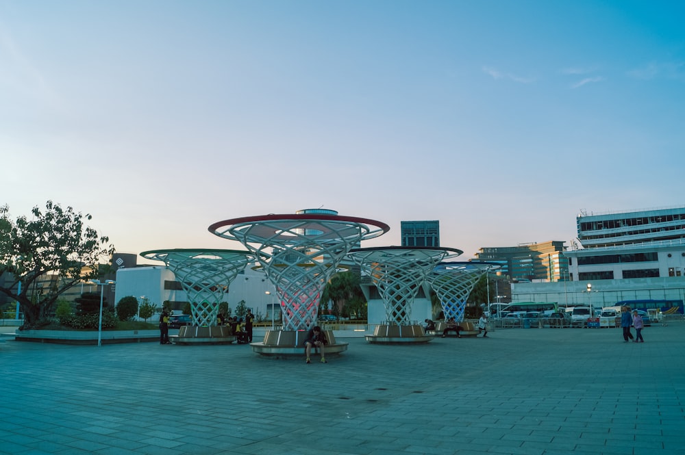 white and red ferris wheel near body of water during daytime