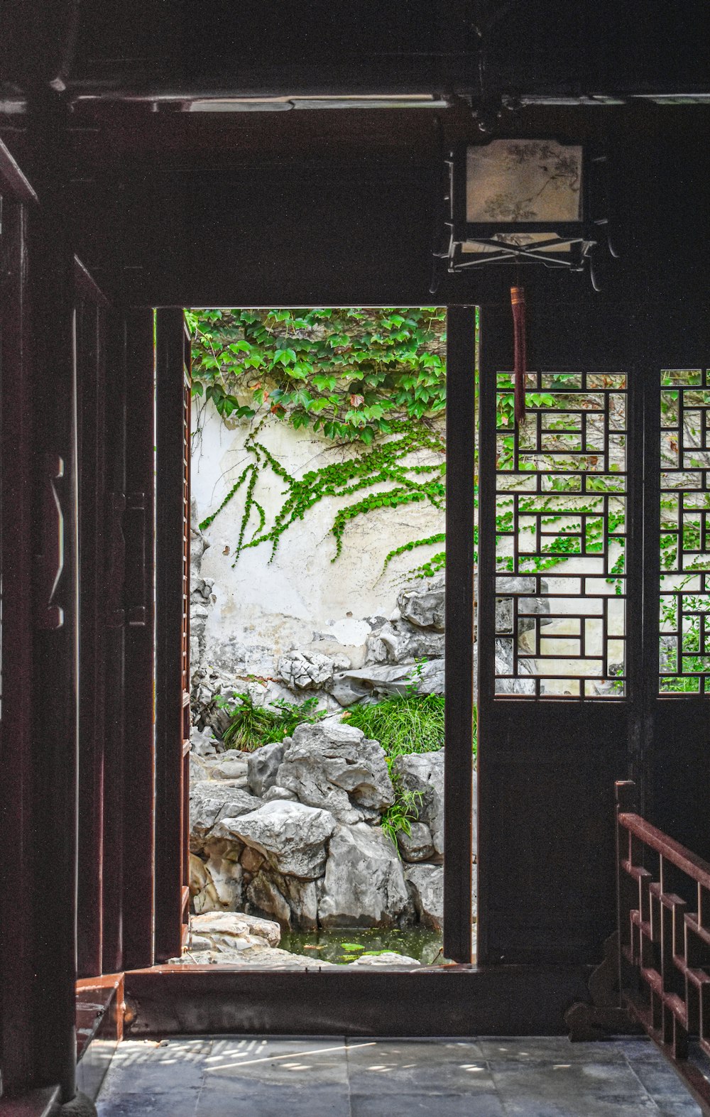 brown wooden door with gray rocks