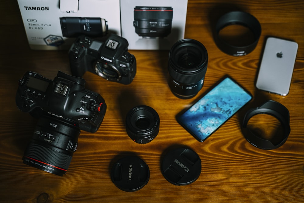 black nikon dslr camera on brown wooden table