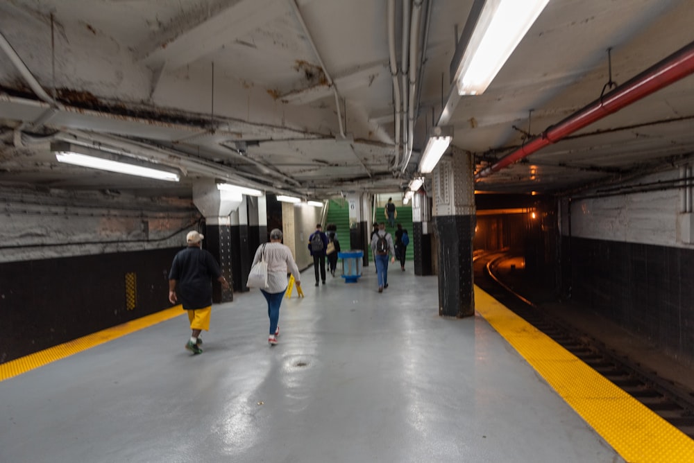 people walking on train station