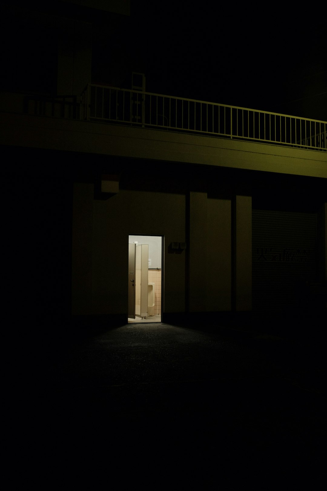 white wooden door in a dark room