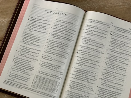 white book page on brown wooden table