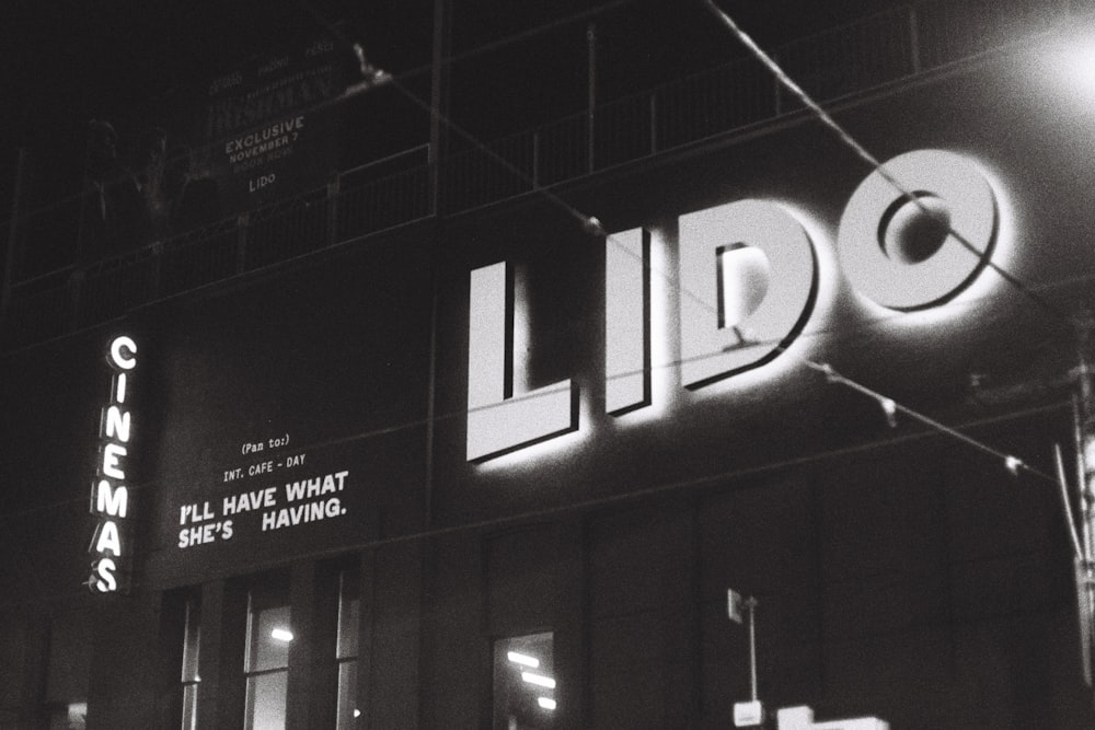 a black and white photo of a building at night