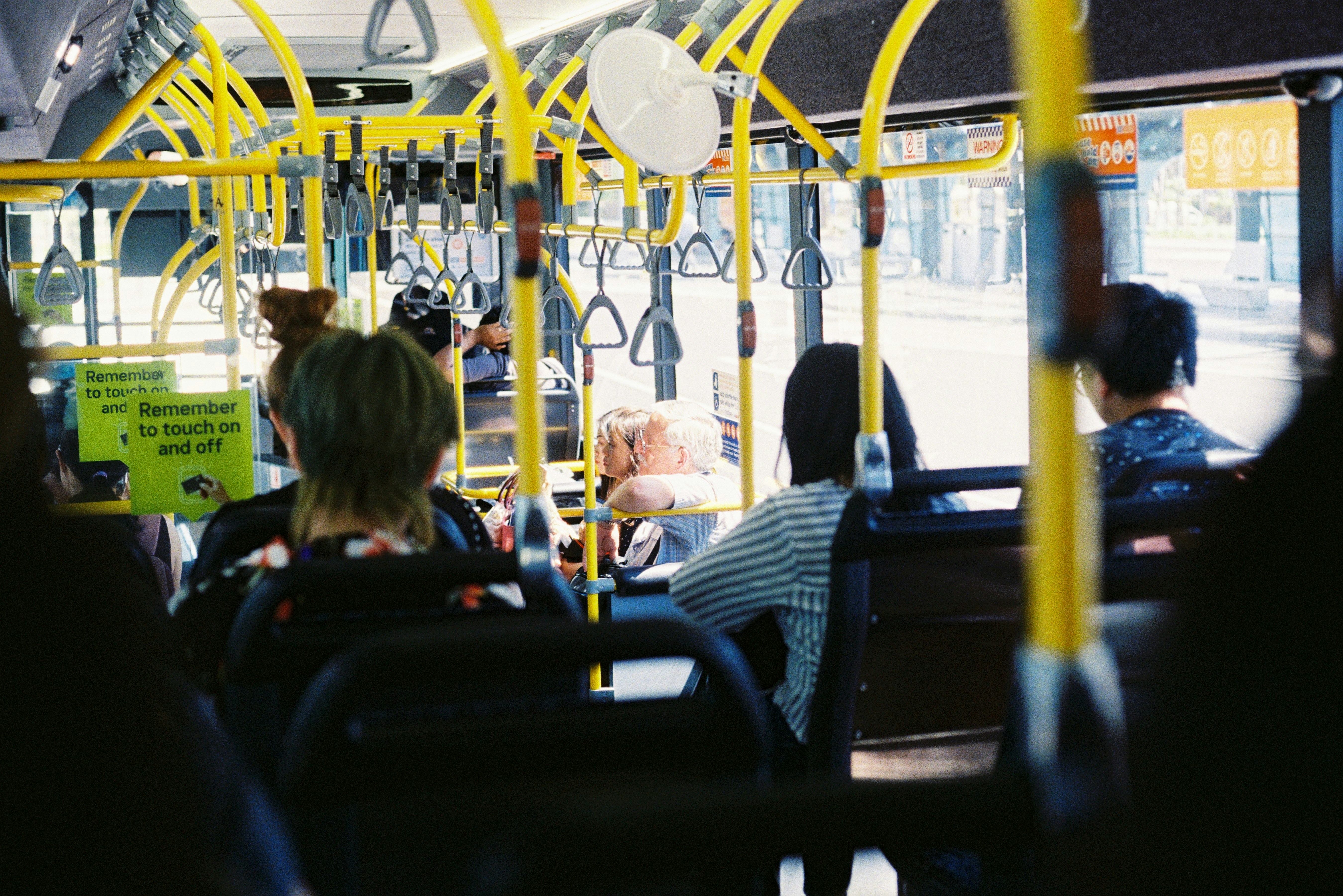 people sitting on chair inside train