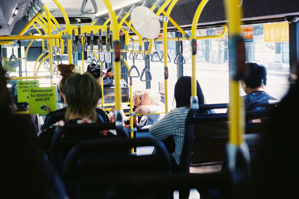 people sitting on chair inside train