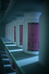 white plastic bottle on green and white table