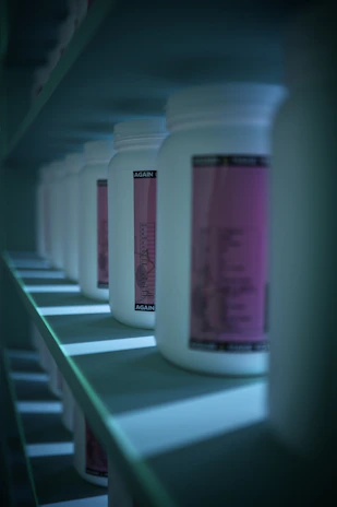 white plastic bottle on green and white table