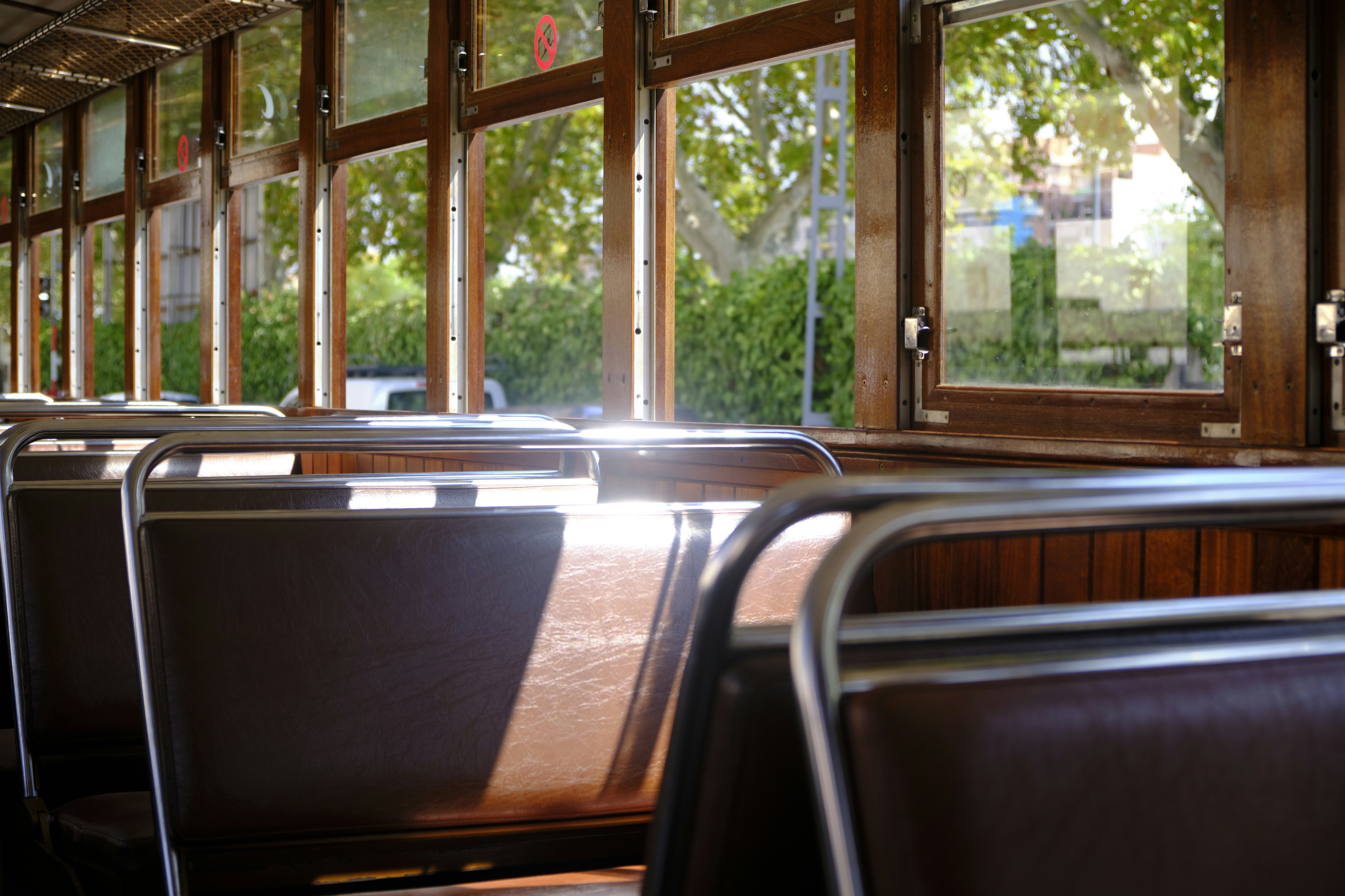 brown wooden framed glass window, The historic train to Sóller, Mallorca. 