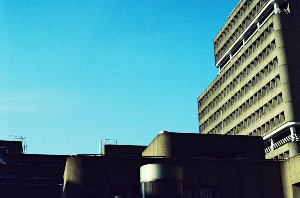 white concrete building under blue sky during daytime