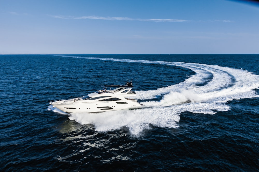 white and black jet plane on sea during daytime