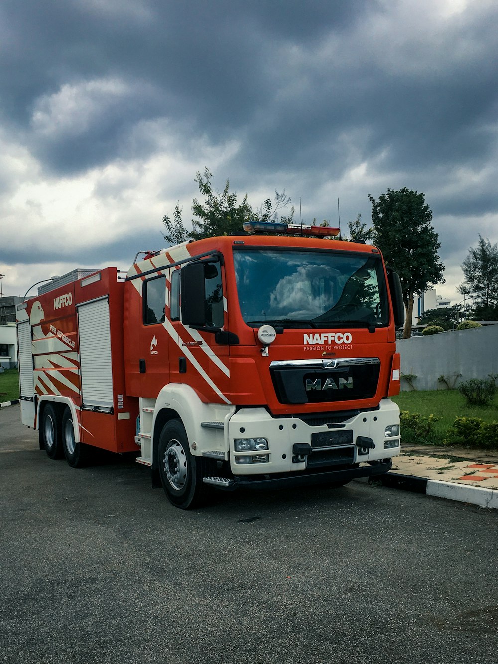 red and white fire truck on road during daytime