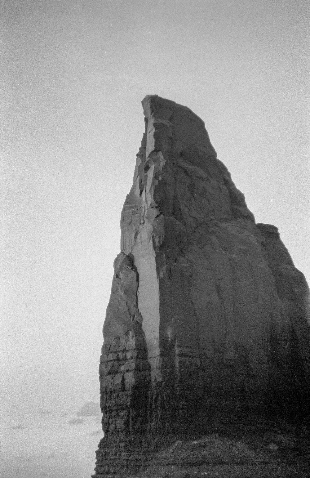 grayscale photo of rock formation