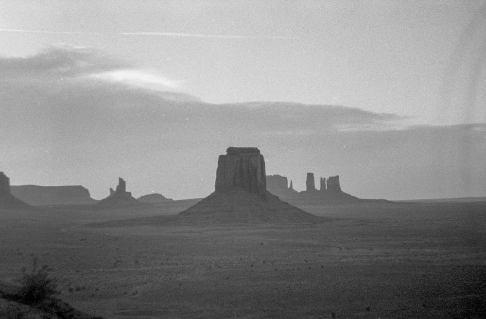 grayscale photo of rock formation