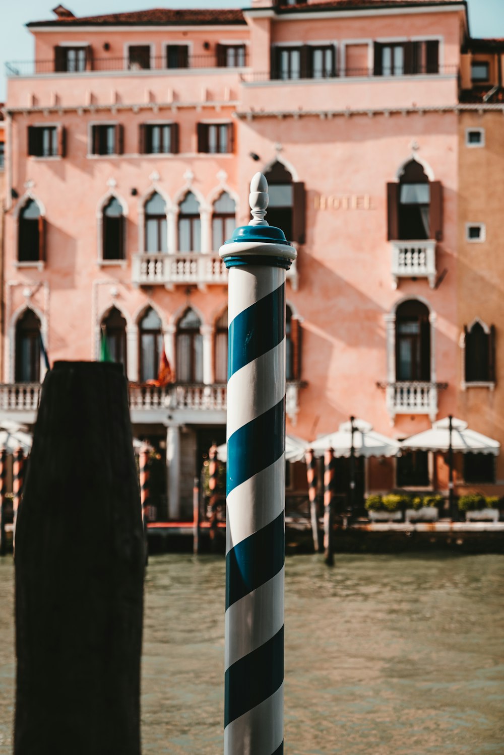 white red and blue striped metal post