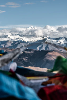 Majestic Garhwal Himalayan peaks with digital DNA helix and neural network overlays blending into traditional Aipan art.