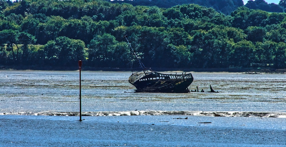 brown ship on body of water during daytime