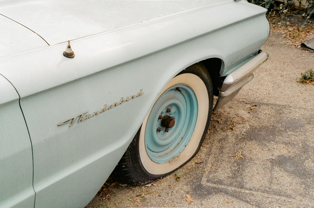 white car on gray concrete pavement