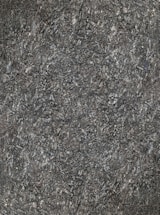 A close-up view of textured asphalt road surface with visible rough and bumpy aggregate particles. The image captures the gritty details and uneven nature of the asphalt material.