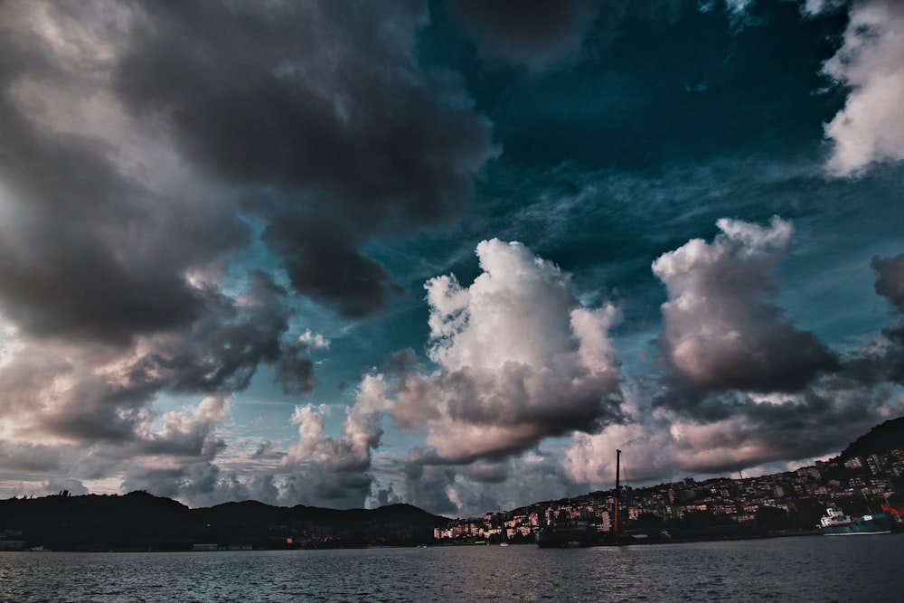 body of water under cloudy sky during daytime