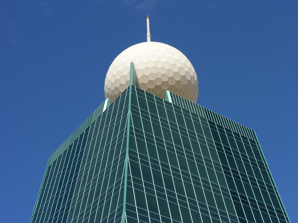 white and black concrete building under blue sky during daytime